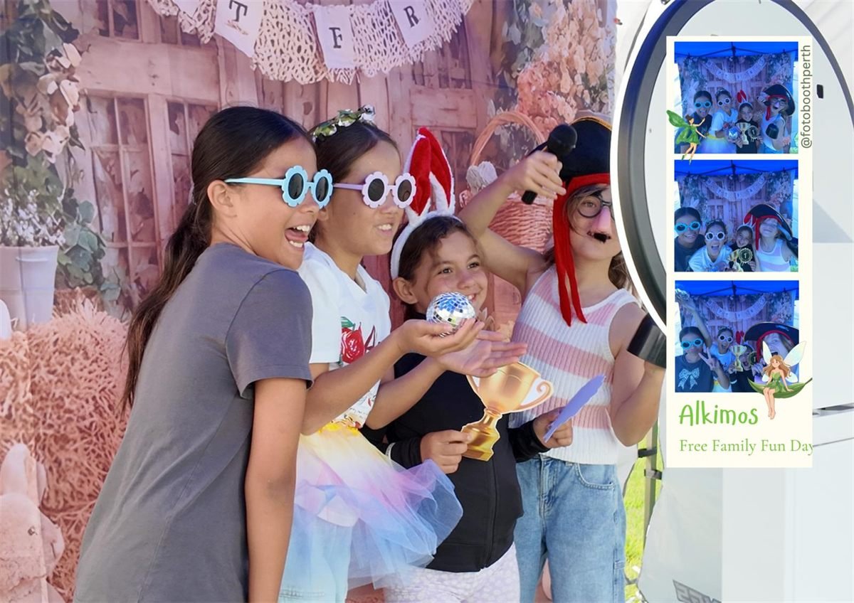 Four children in dress-up props including flower sunglasses, bunny ears and a pirate hat, laughing at a Fotobooth Perth booth at the Alkimos Free Family Fun Day, with their photo strip alongside