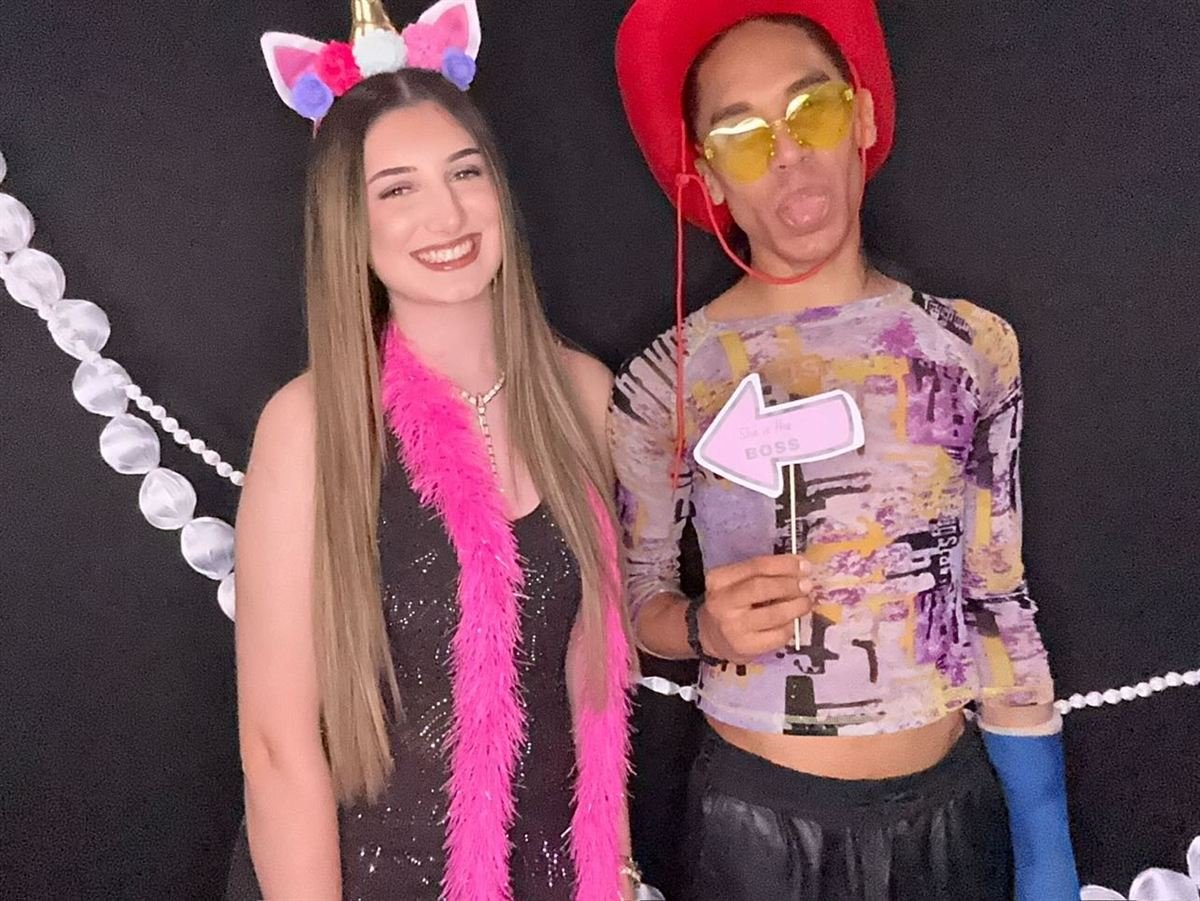 Guests with props at a Perth birthday party photo booth