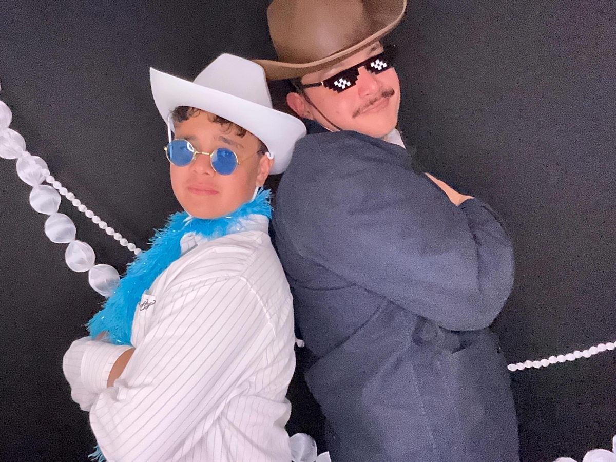 Guests with props at a Perth birthday party photo booth