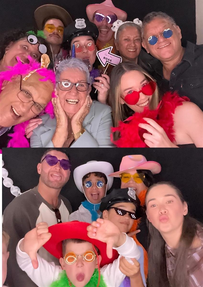 Big group with props and boas at a Perth photo booth