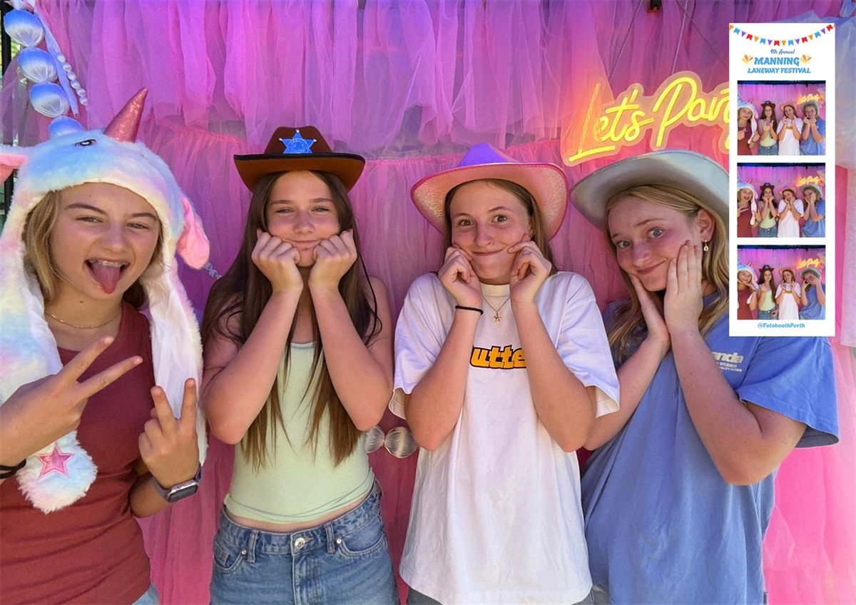 Guests in dress-up props at the Fotobooth Perth booth at the 4th Annual Manning Laneway Festival, against a pink and purple tulle backdrop, with their printed photo strip shown alongside